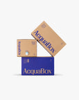 Stack of AcquaBox Natural Mineral Water bag-in-box dispensers in 10L, 15L and 20L sizes, recyclable packaging by Mountain Falls